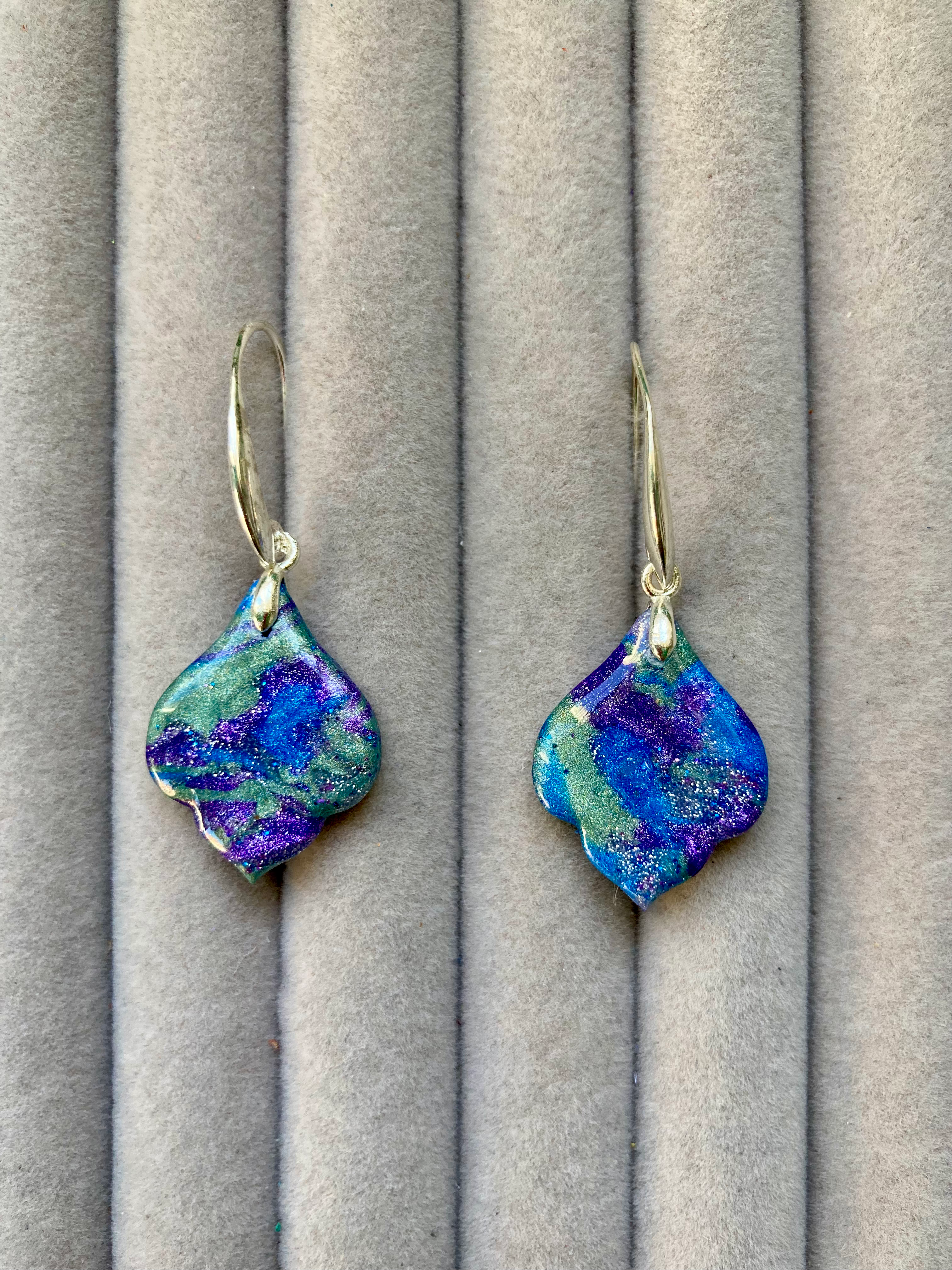 Small elegant leaf earrings in purple, blue and green on hook backs