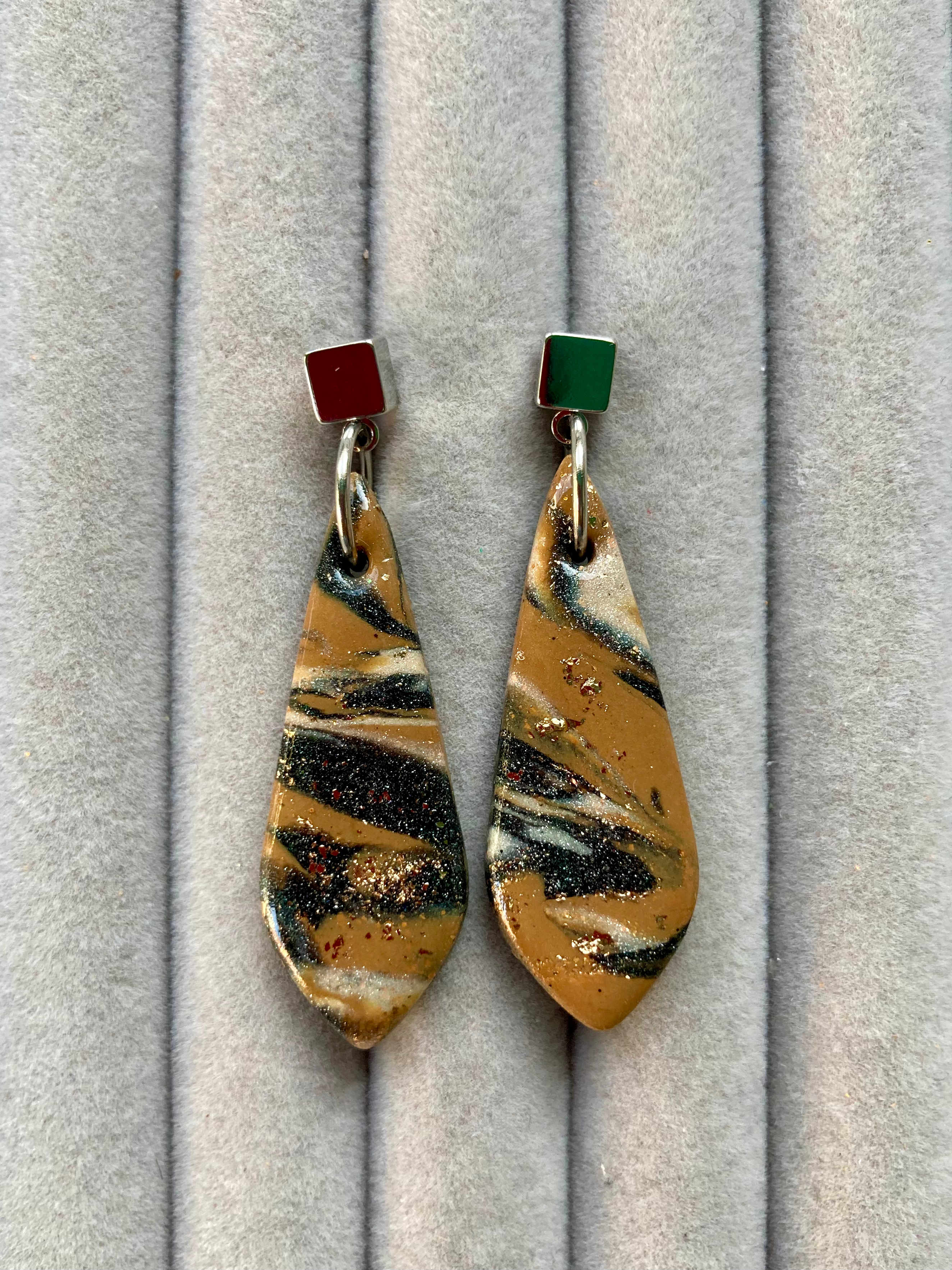 Marbled brown and black longline rounded earrings on studs