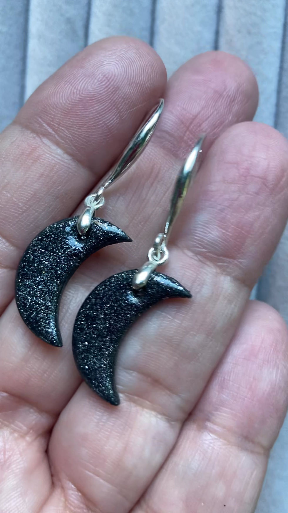 Thumbnail: Small sparkly Black Moon earrings on simple elegant pinch hooks