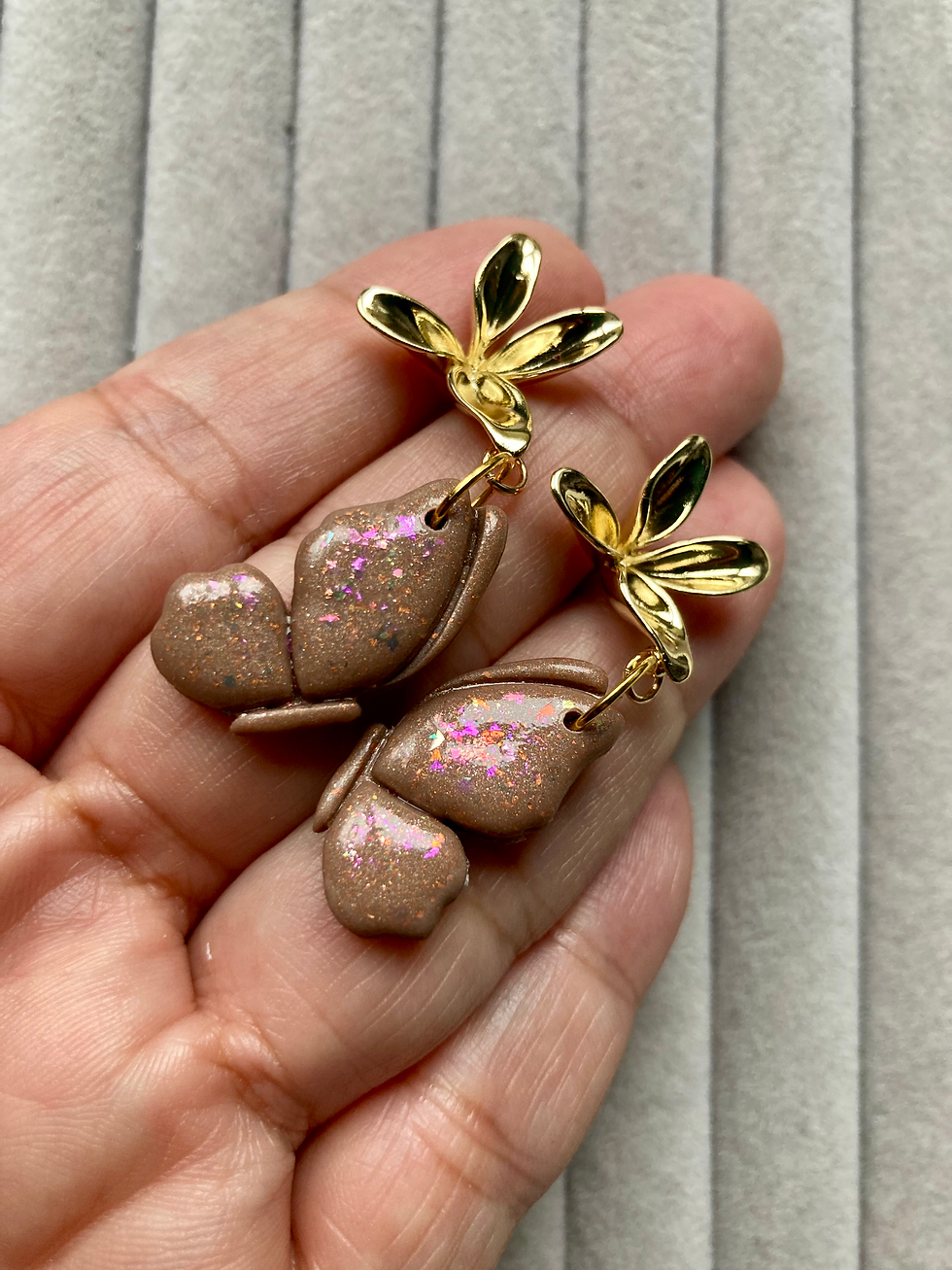 Thumbnail: Brown-pink butterfly earrings on gold plated  flower fittings