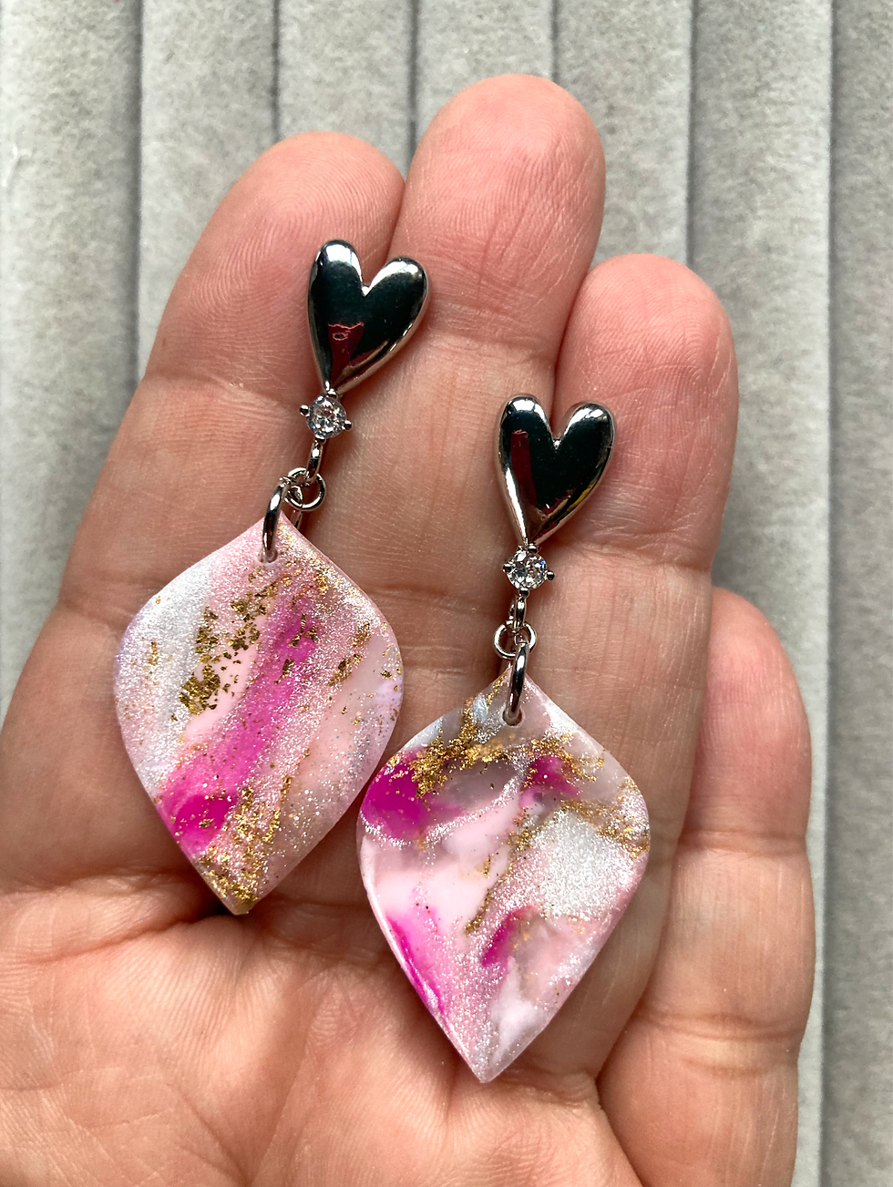 Thumbnail: Marbled pink and white drop earrings on stainless steel heart studs