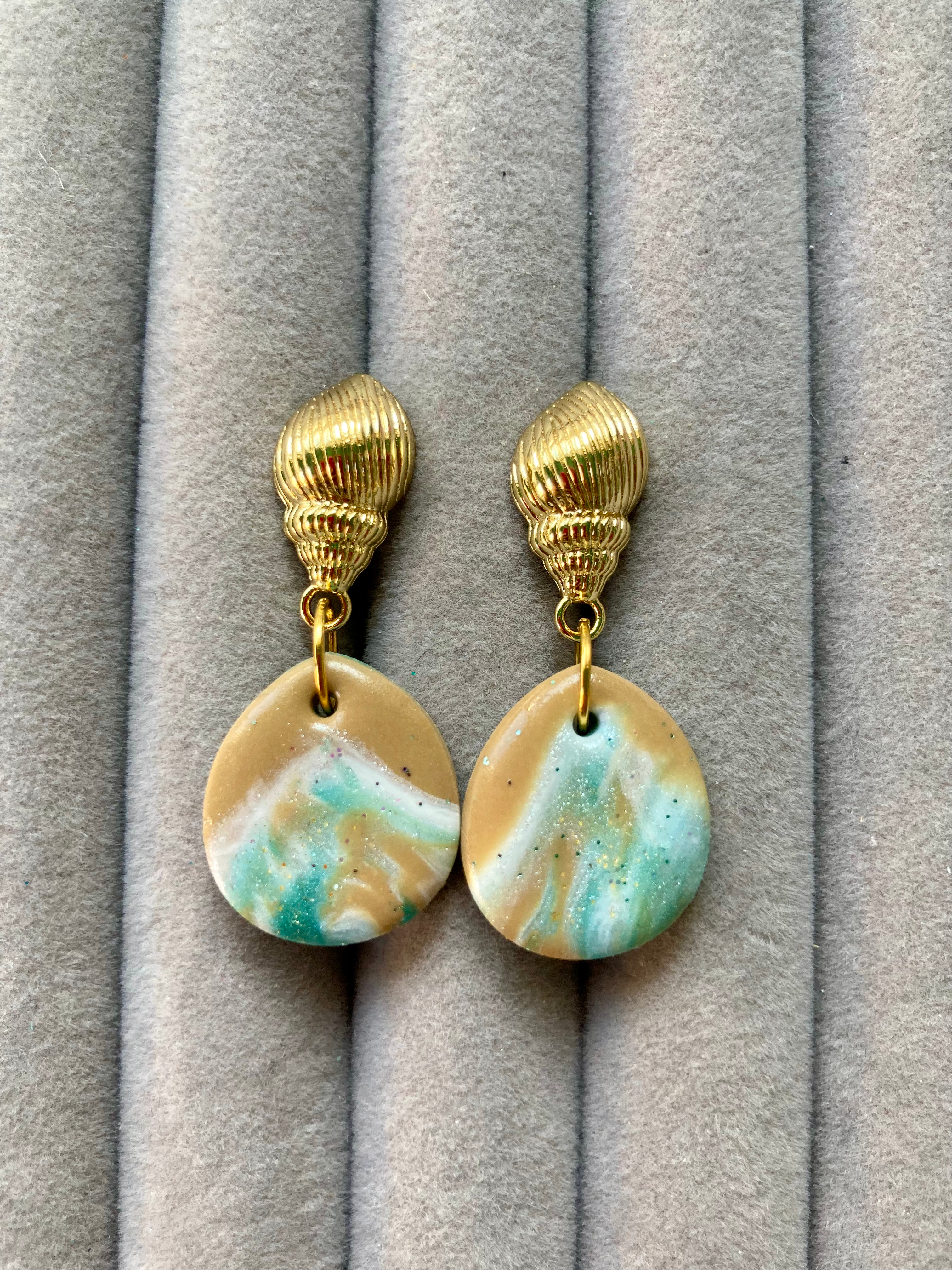 Shimmery white, brown and teal drop earrings on gold plated sea shell studs