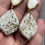 Thumbnail: White large leaf earrings with metallic specs on gold plated shell stu