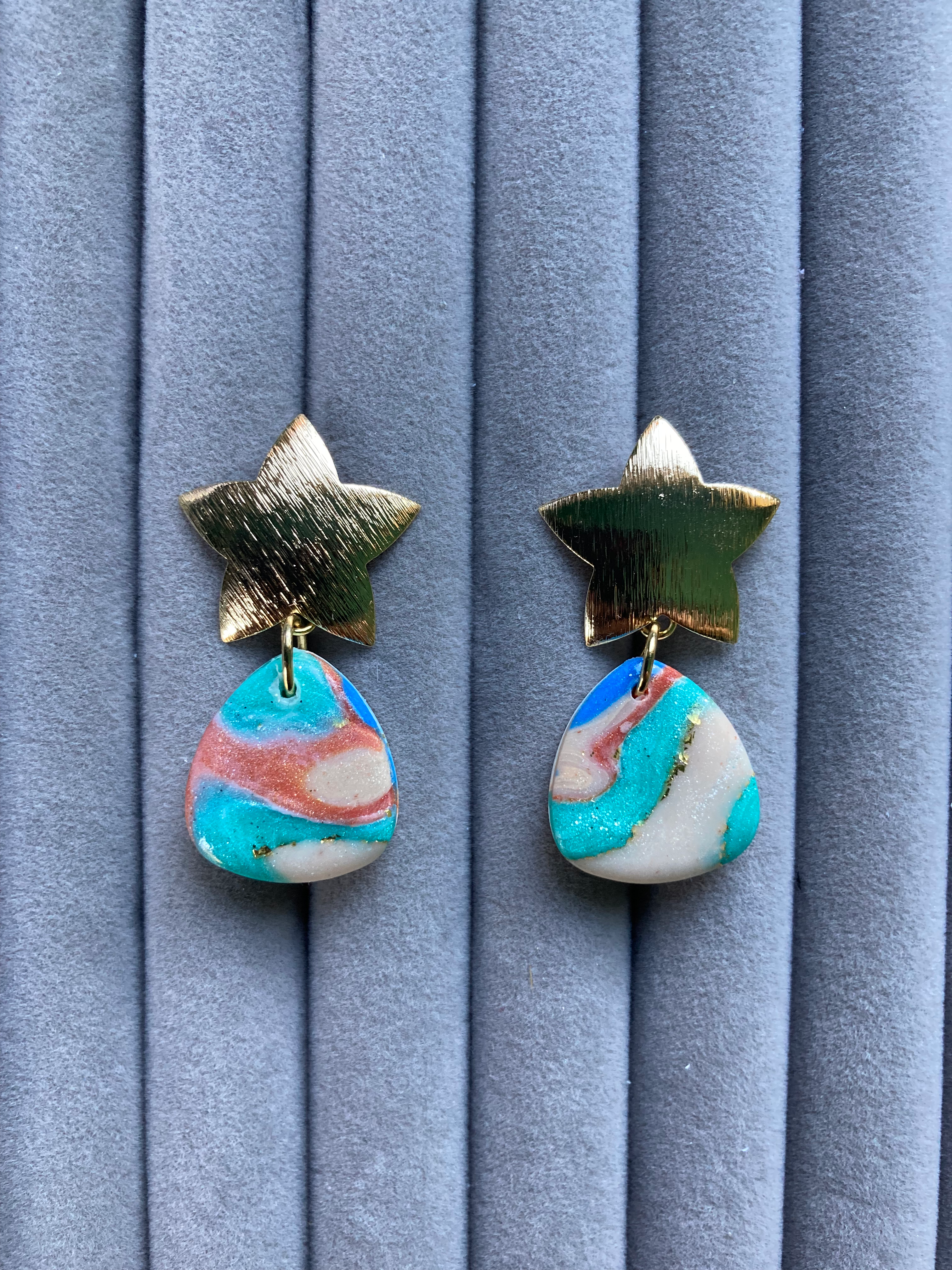 Blue, green, orange and cream earrings on brushed gold star studs
