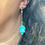 Thumbnail: Green teal dangle earrings with green topaz beads
