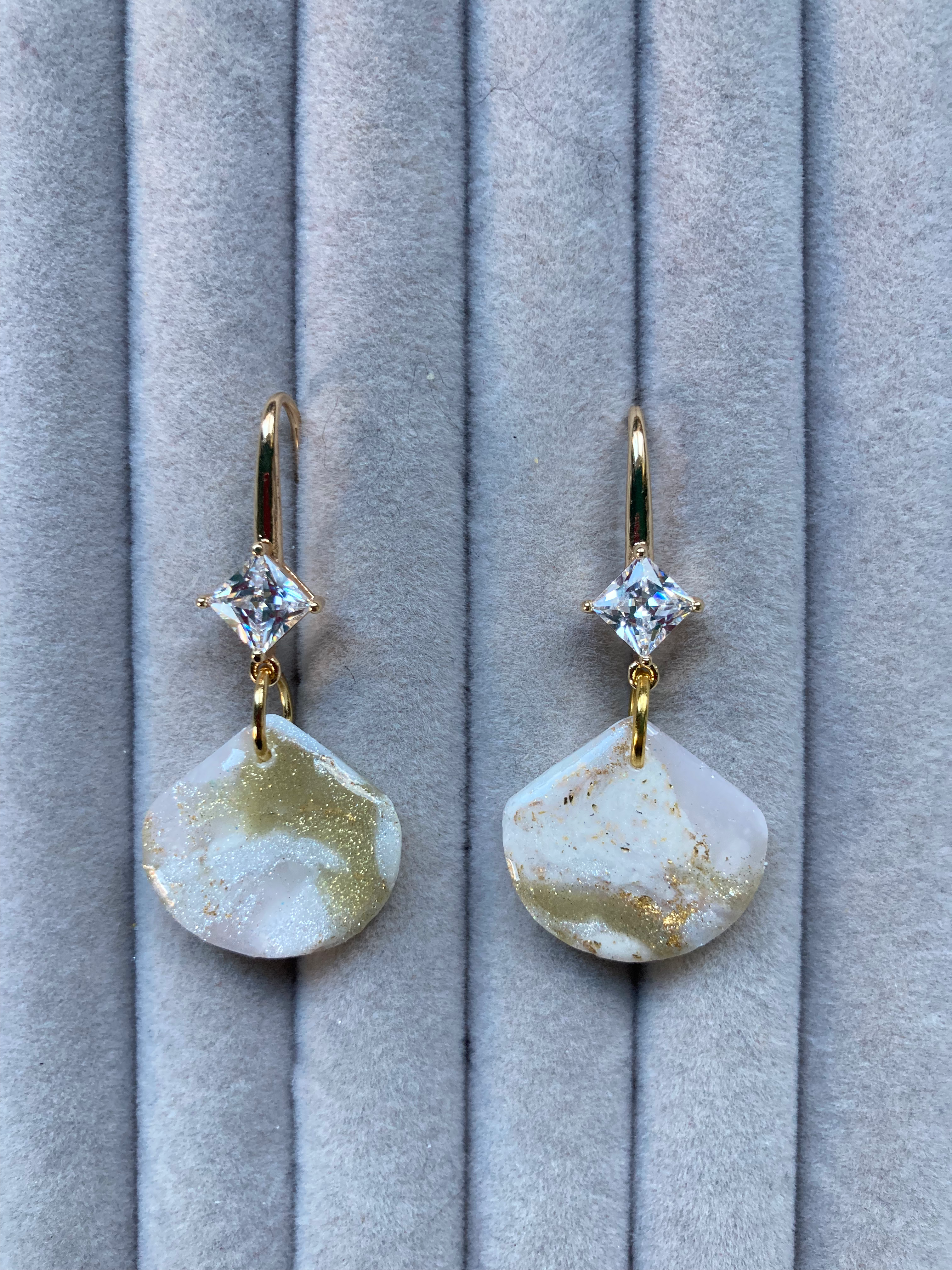 Sparkly gold and white fan earrings on gold plated hook backs with crystals