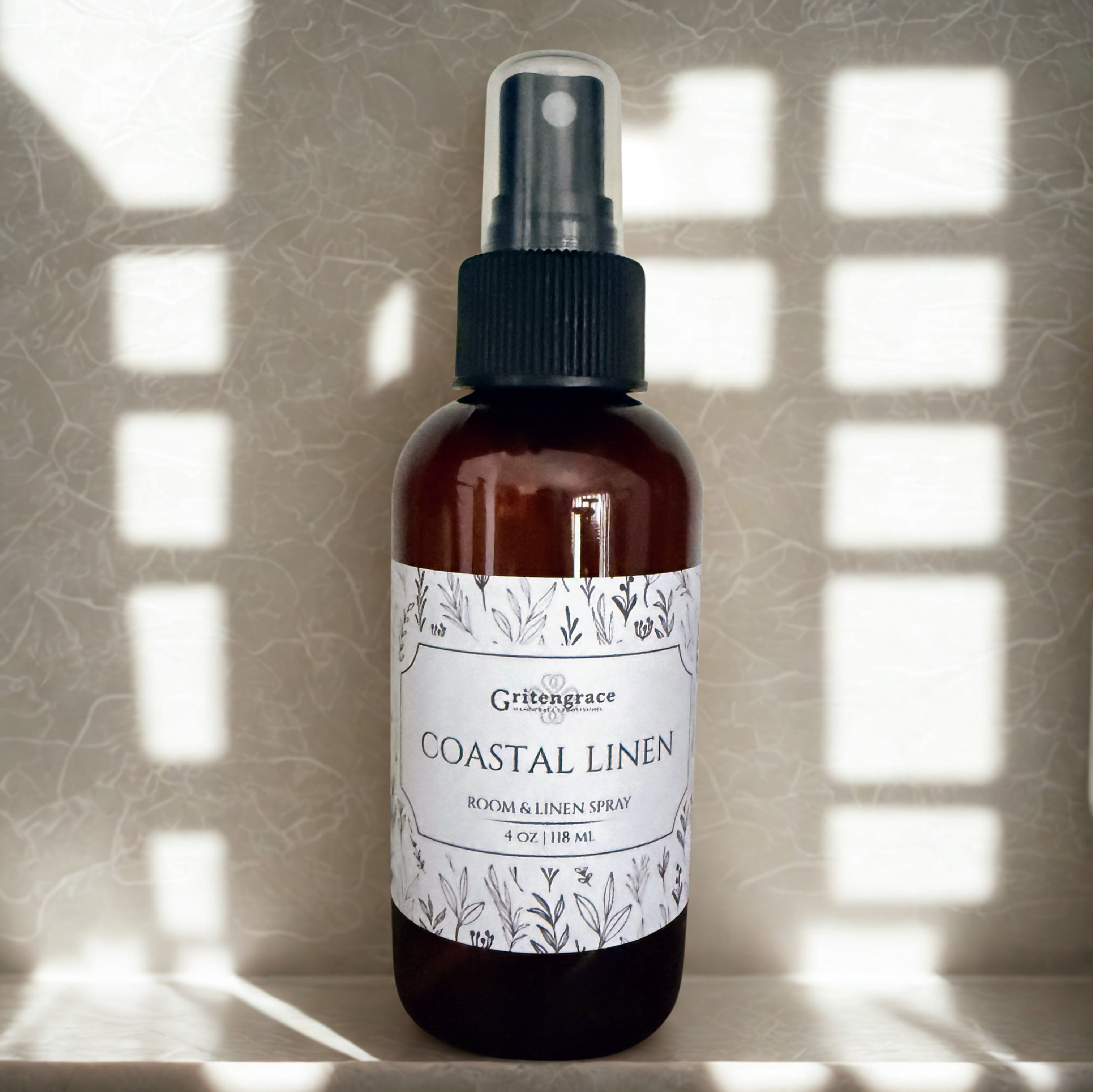 coastal linen room and linen spray on a white counter