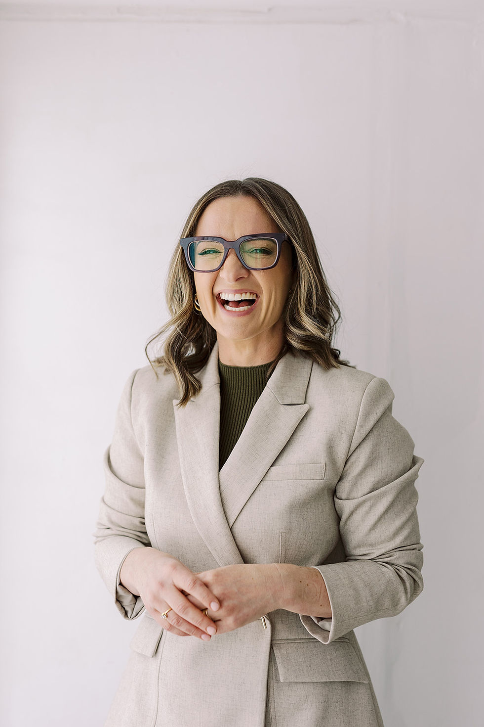 a politician smiling at the camera during her headshot photoshoot