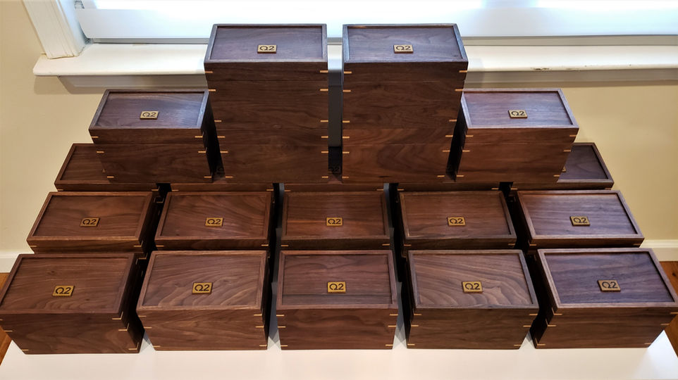 A collection of walnut keepsake boxes made for a client's employees as a recognition for 10 years of service.