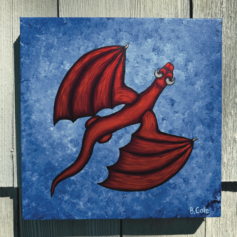 Red Dragon flying over the water.