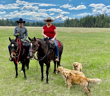 Traci and Drew Orr of Oracle Farms Golden Retrievers with our puppies in Central Oregon