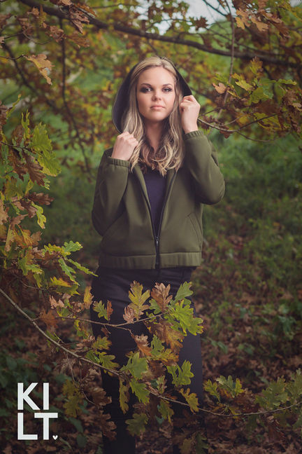 A. Model in a green hoodie for Hawke's Bays Kilt Clothing