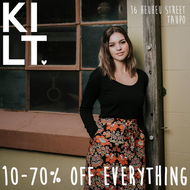 Fashion photography for Kilt Clothing in Hawke's Bay with a girl standing in front of a building