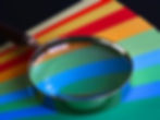 Spectrum of colors magnified with a magnifying glass 