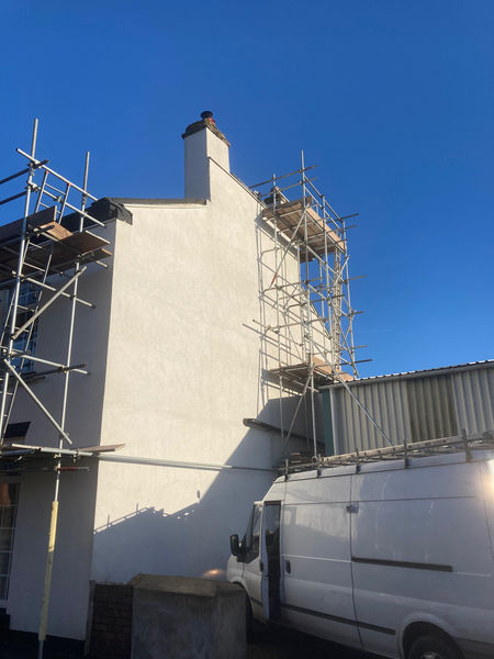 side view of a property with scaffolding