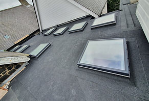 EPDM rubber roof installed on home extension with sky view
