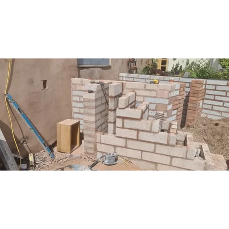 Blocks in the garden piled with other blocks.