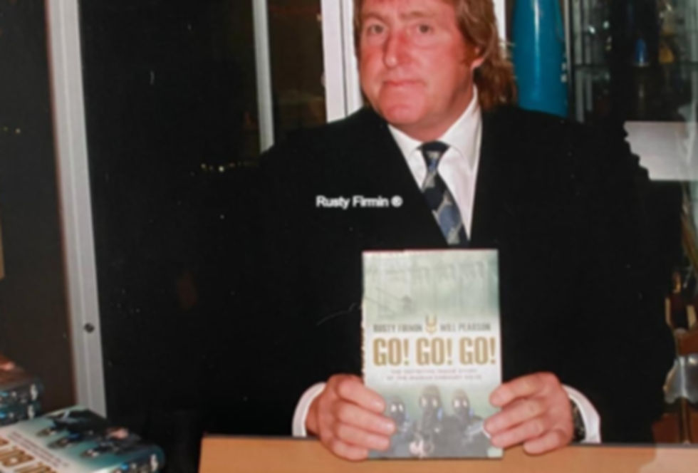 Walter Firmin with his book at a signing.