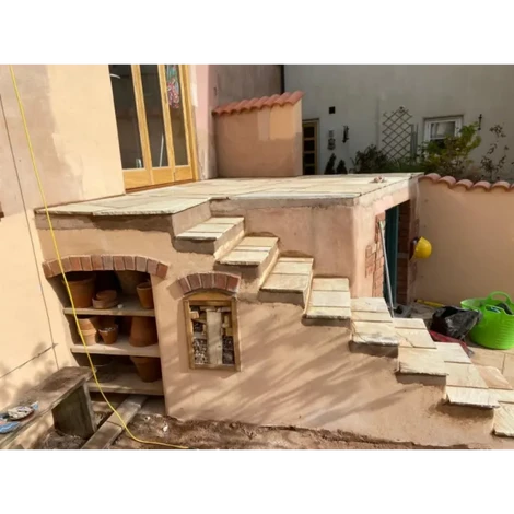 Raised concrete platform project with indian sandstone slabs put in by DG CARPENTRY AND PROPERTY MAINTENANCE.
