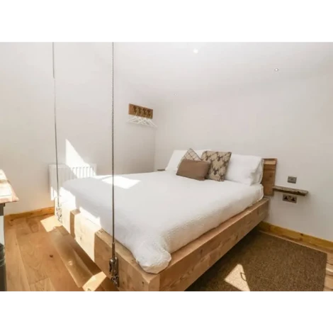Design and construction of a timber frame hanging bed.