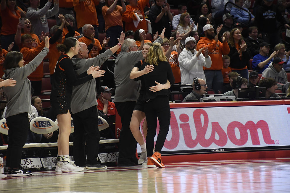 Washington coach Kim Barth celebrates the program's first-ever state title in the aftermath of the Panthers' 60-45 win against Chatham Glenwood in the Class 3A state championship game on March 7, 2026 at CEFCU Arena in Normal.