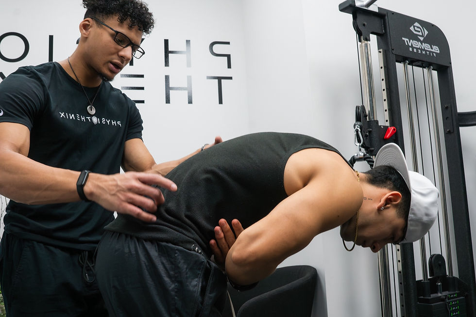 healthcare practitioner assessing lower back of a patient