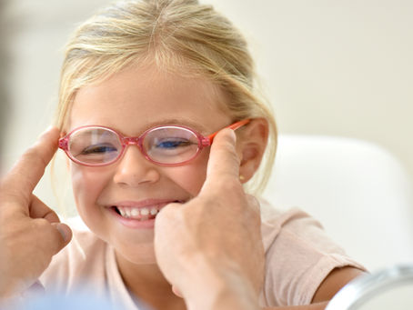 Child receiving a modern digital eye exam with advanced technology
