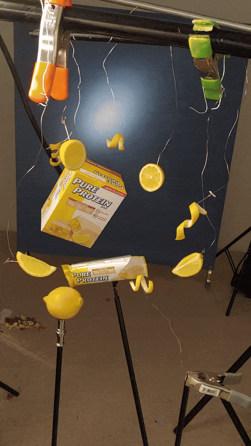 Pure Protein Behind the Scene gif with lemon slices and peels on a wire