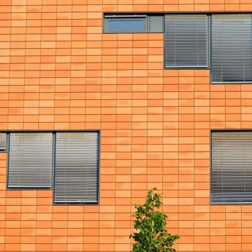 orange-facade-with-windows-e1718703504840-qqomzwn29i95vo5f2oos50h9cnkkkhj6nu7684dmrs.jpg