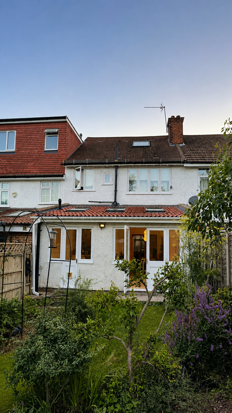 Finished open plan living space with rooflights and garden access