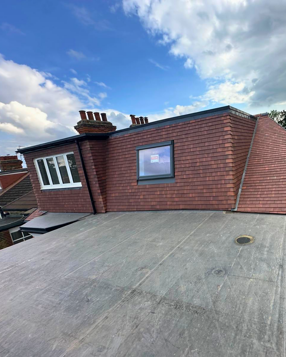 Completed twin loft dormers with new windows in North London home