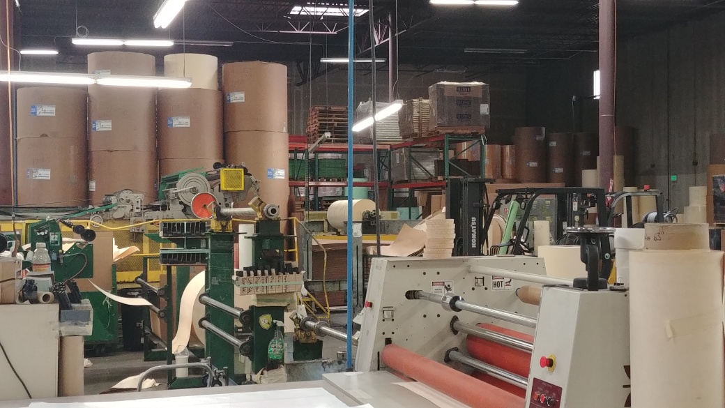 Converting machinery with rolls of paper and synthetics