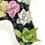 Thumbnail: A lovely vintage off white posy vase filled with colourful succulents