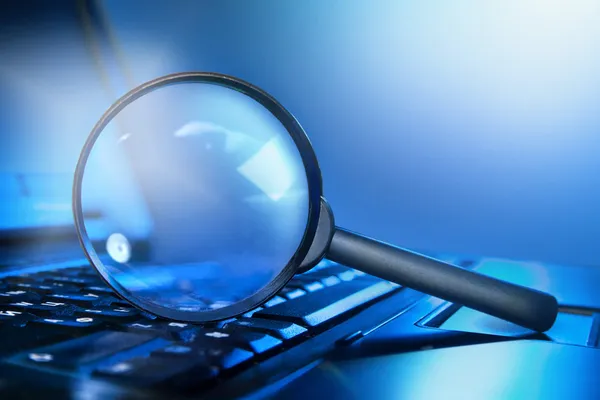 depositphotos_10525934-stock-photo-magnifying-lens-on-the-laptop.webp