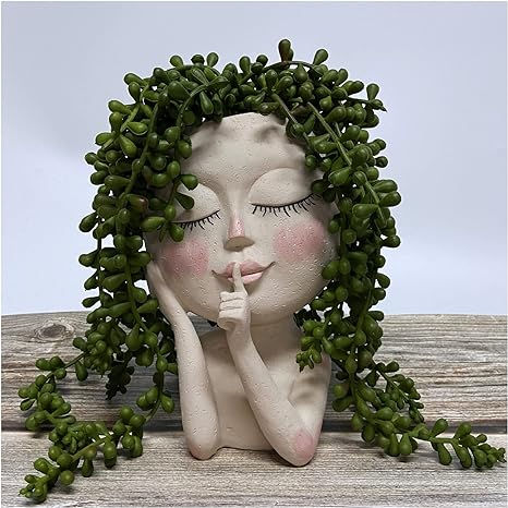 grey plant pot with woman smiling face