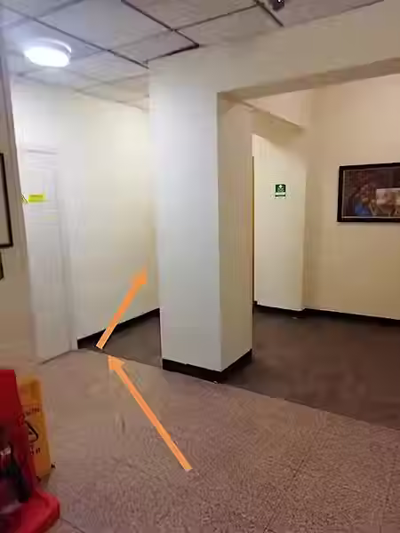 A curved arrow directing people downstairs to the right.
