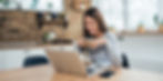 Entrepreneur scaling business with support from a virtual assistant
