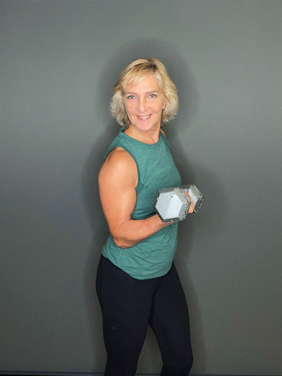 Maggie holding dumbbell.JPG
