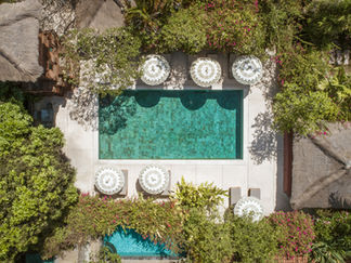 Aerial view of refreshing pool with umbrellas