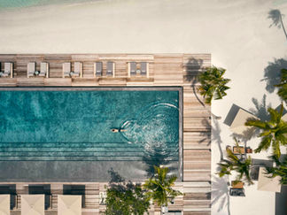 Person swimming in resort pool