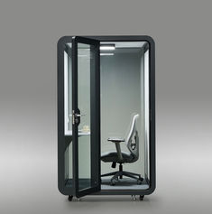 Front view of the black SoloPod Pro with door open and interior chair visible.