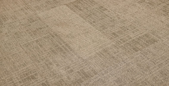 Detail shot of the premium acoustic floor tiling inside the executive pod.