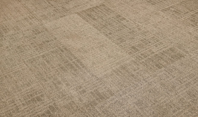 Detail shot of the premium acoustic floor tiling inside the executive pod.