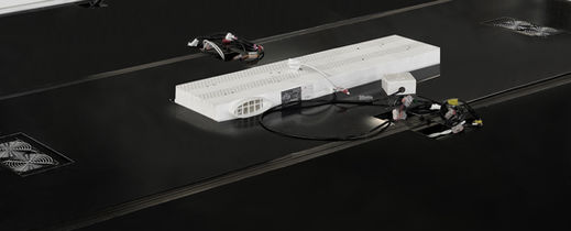 Close-up of executive pod power hub with USB, data, and 110V outlets.