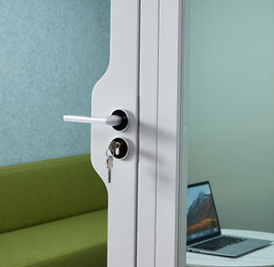 Vertical shot of the sleek aluminum door frame and acoustic seal.