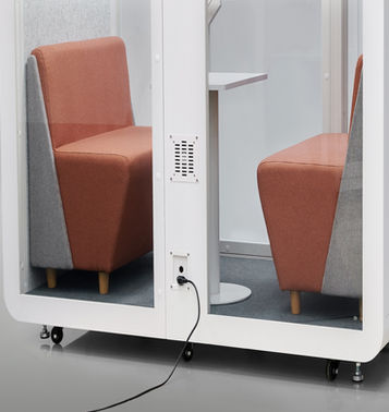 Modern exterior showing the deep-set footprint of the 2-4 person DuoPod Pro office privacy suite.