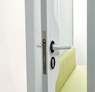 Exterior door hinge detail of a soundproof conference pod.