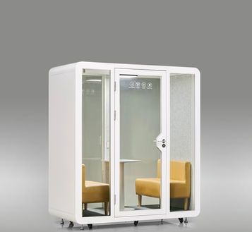 Left-side angle of the white DuoPod Compact meeting booth.