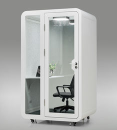 White SoloPod Pro with door fully open showing internal chair and desk.
