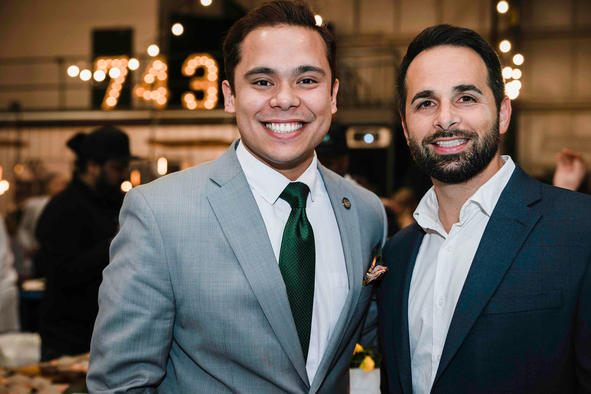 Two men smiling, BGCCA members, Justin Reuter and another, CEO transition.